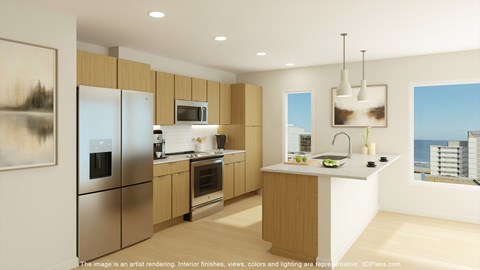 A modern kitchen with wooden cabinets and stainless steel appliances.